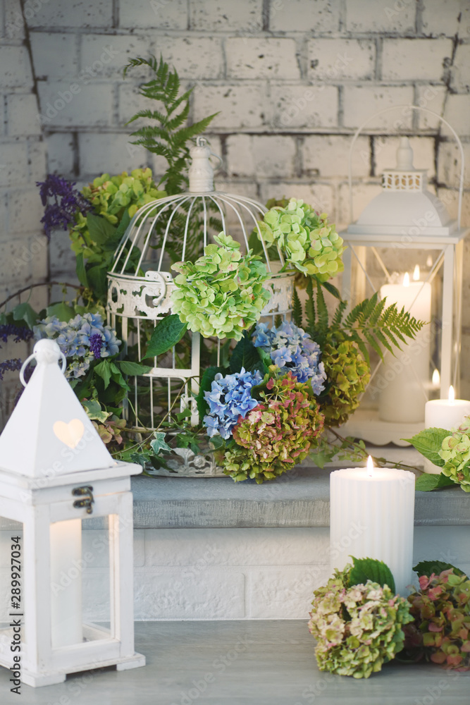 beautiful floral arrangement with lanterns and candles