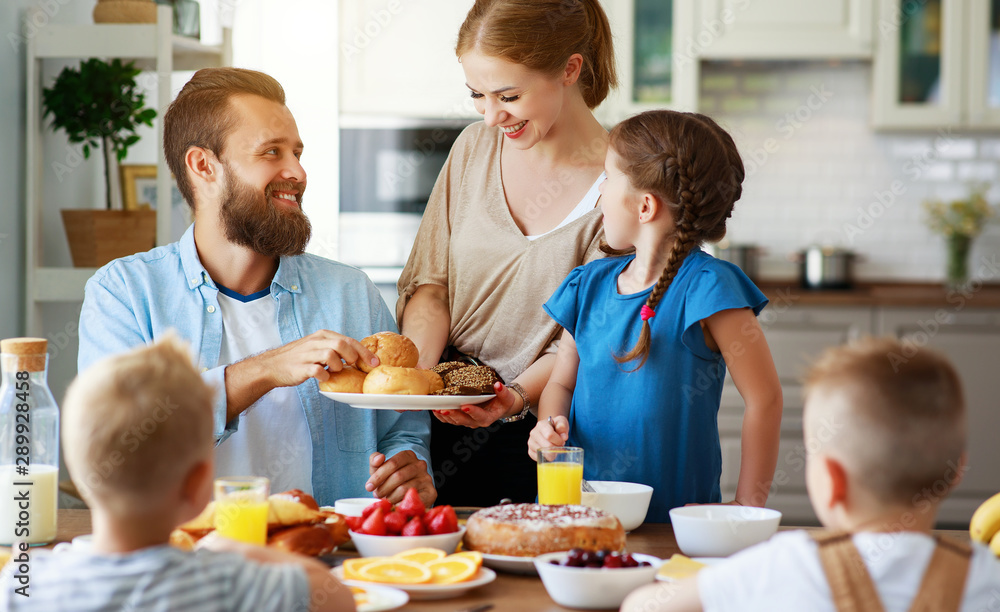 family mother father and children have Breakfast in kitchen in morning. family mother father and children have Breakfast in kitchen in morning.