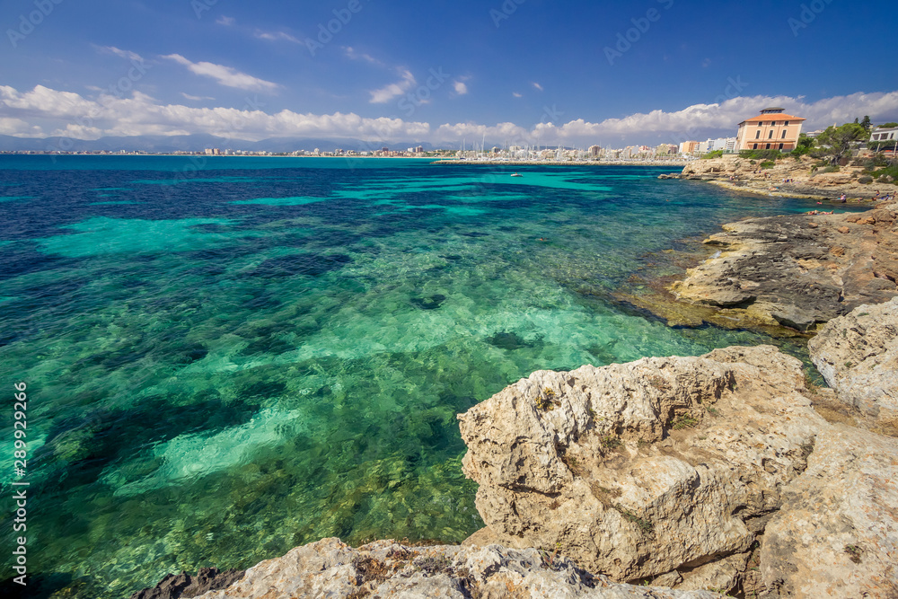 coastline of Mallorca turquoise waters of Mediterranean Sea sunny day, bright colors, Balearic Island, Spain