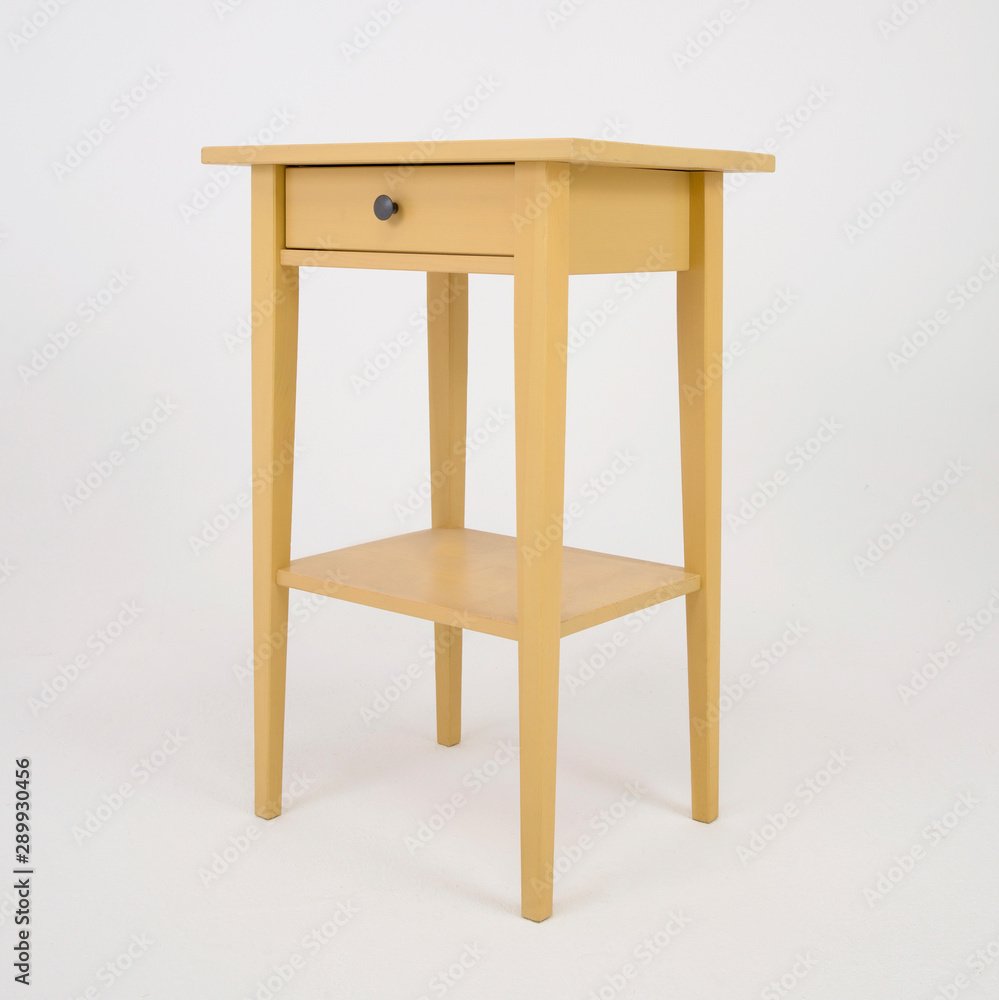 Wooden yellow nightstand with drawer on white isolated background by side Wooden yellow nightstand with drawer on white isolated background by side