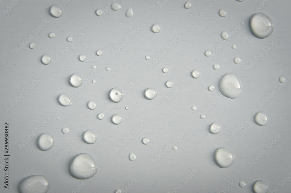 Large drops of water on a white surface. Large drops of water on a white surface.
