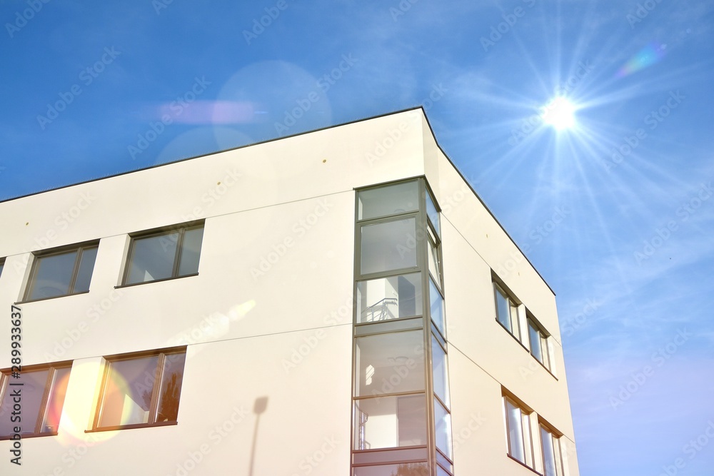 Modern office building detail, glass surface with sunlight Modern office building detail, glass surface with sunlight