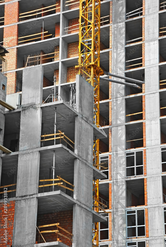 Crane and highrise construction site Crane and highrise construction site