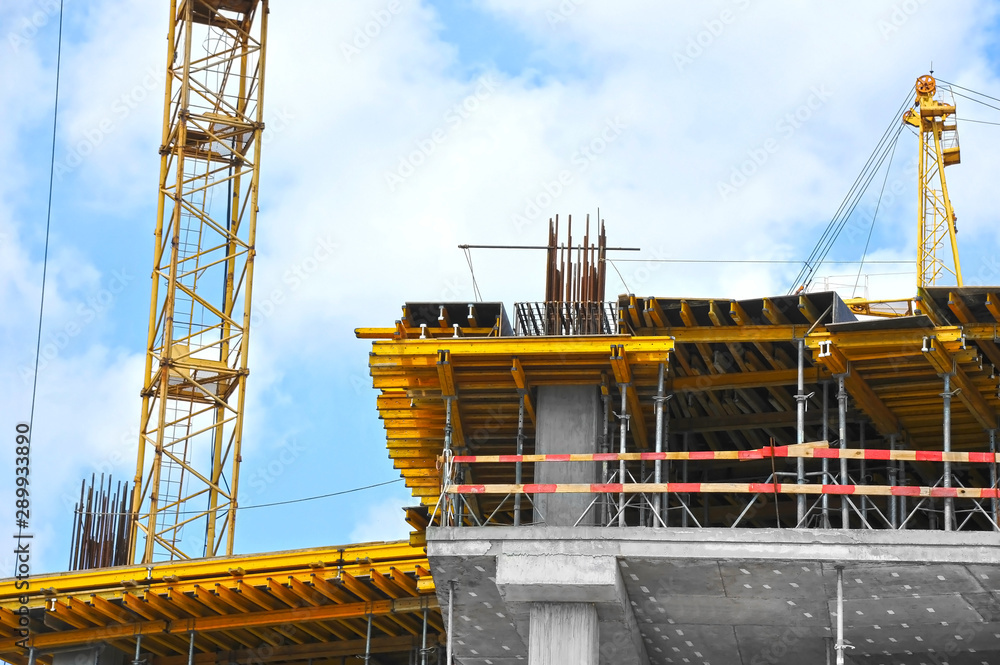 Fototapeta premium Crane and highrise construction site