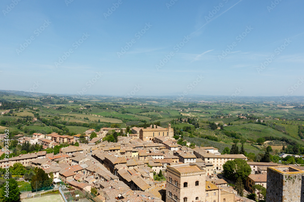 Looking out over the Tuscan countryside from a tower inside San Gimignano, a small walled medieval hill town in the province of Siena, Tuscany, north-central Italy