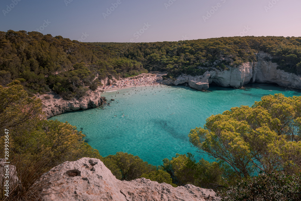 Obraz premium Cala Mitjana and Cala Mitjaneta beaches at the south coast of Menorca Island, Spain.