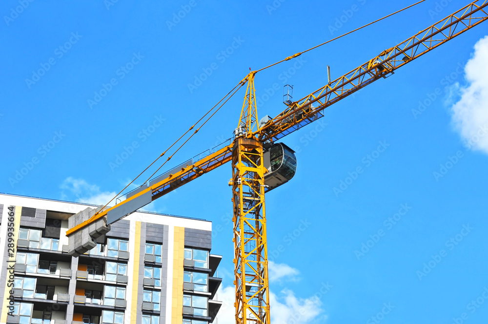Crane and highrise construction site Crane and highrise construction site