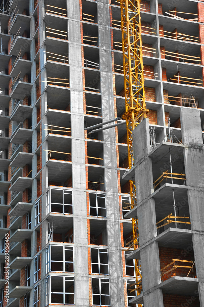Crane and highrise construction site Crane and highrise construction site