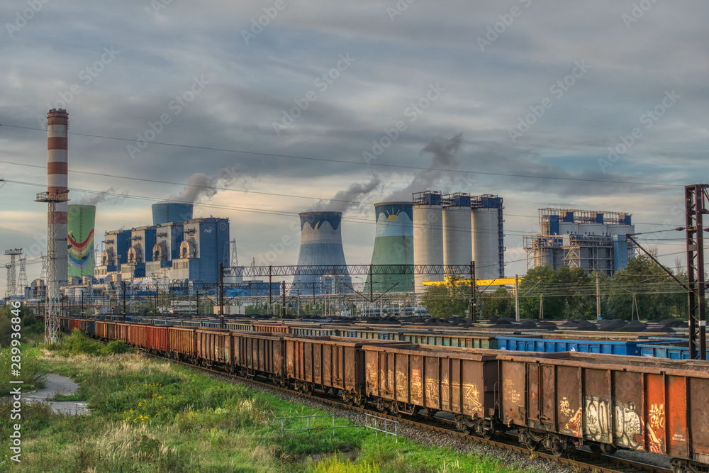 view of the coal power plant and railway siding, transport of hard coal to the power plant, industrial landscape, environmental protection against air pollution