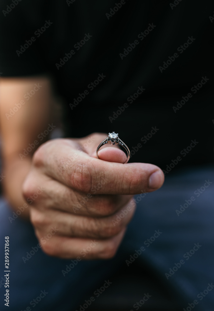 Man proposing with the engagement diamond ring