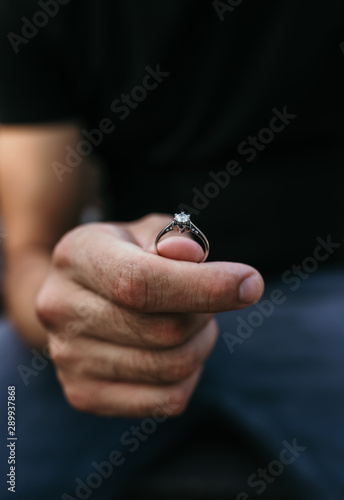 Man proposing with the engagement diamond ring
