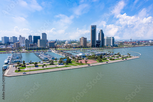 Corpus Christi ocean drive. Corpus Christi City Skyline at Day in Texas - Cityscape. Panorama aerial view with skylines and marina piers row of boat, sailboat and yacht  photo