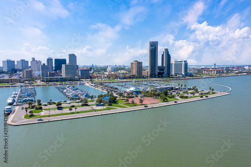 Corpus Christi ocean drive. Corpus Christi City Skyline at Day in Texas - Cityscape. Panorama aerial view with skylines and marina piers row of boat, sailboat and yacht 