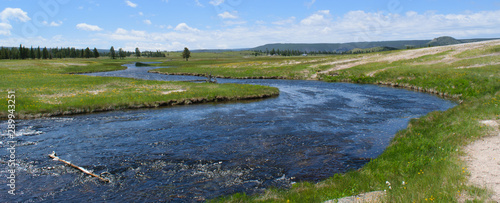 River in a prairie field in Yellowstone National Park, Wyoming, USA
