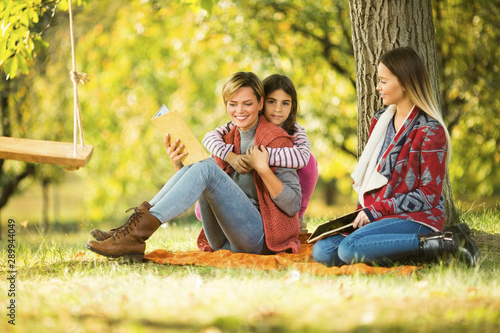 Mother and aunt with a child in park