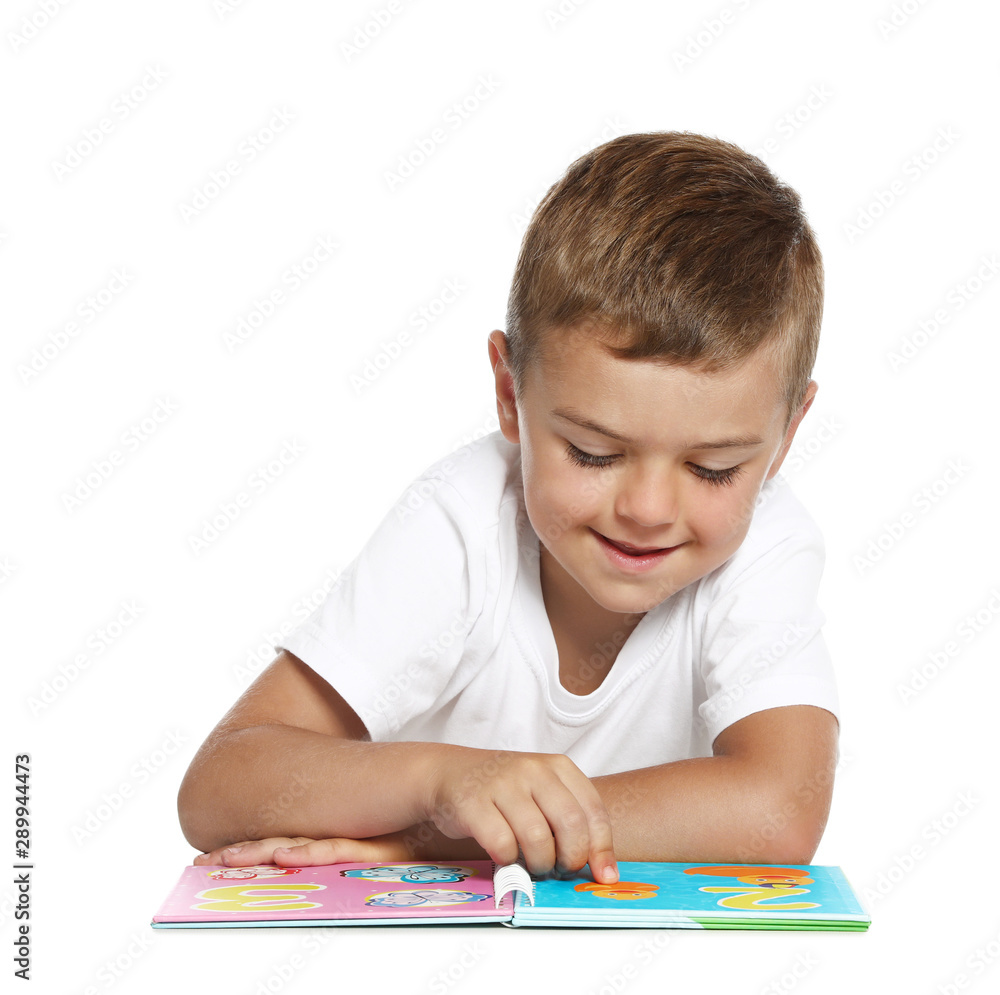 Cute little boy reading book on white background Cute little boy reading book on white background