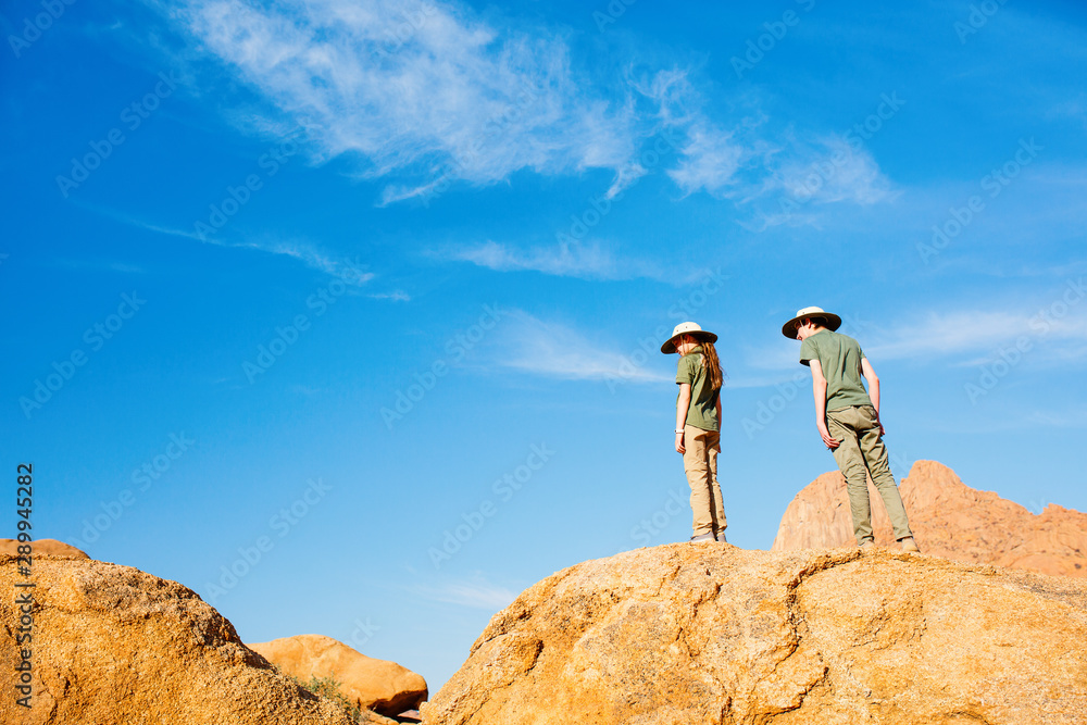 Kids hiking in Spitzkoppe Namibia