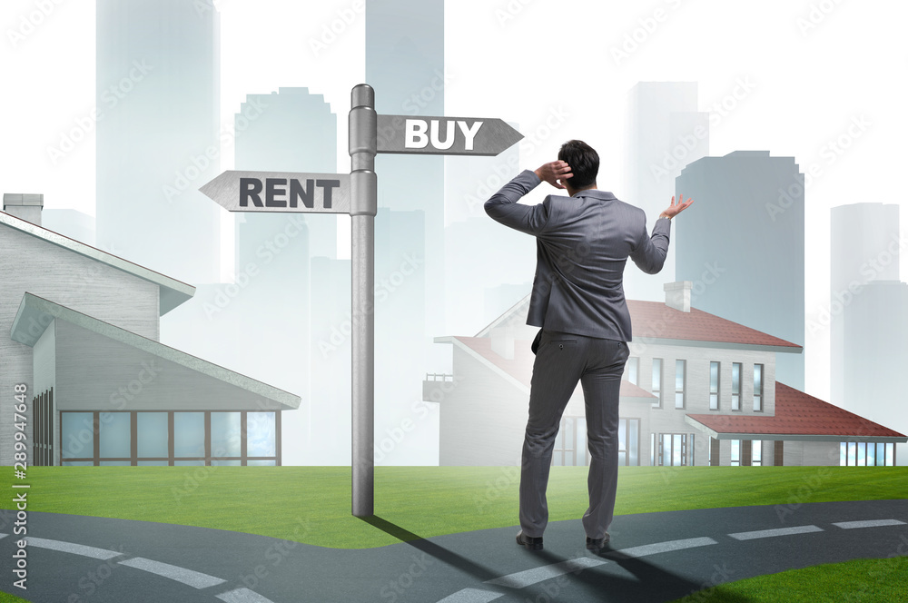 Businessman at crossroads betweem buying and renting Businessman at crossroads betweem buying and renting
