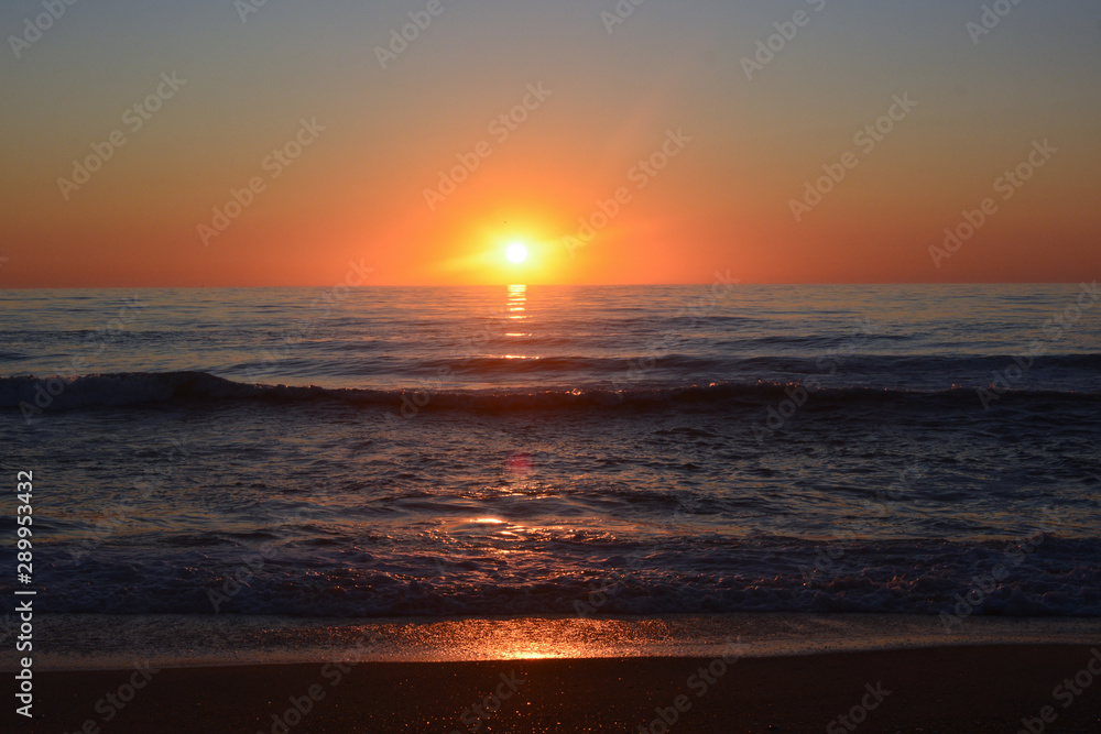Sunrise over the Atlantic ocean as seen from Rodanthe on the Outer Banks of North Carolina Sunrise over the Atlantic ocean as seen from Rodanthe on the Outer Banks of North Carolina