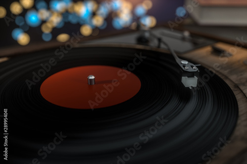The old wooden vinyl record player on the table, 3d rendering.