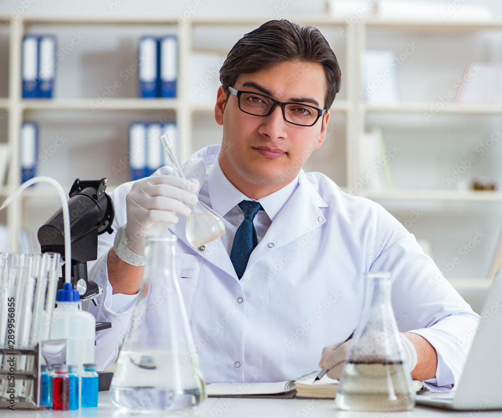 Young researcher scientist doing a water test contamination expe Young researcher scientist doing a water test contamination expe