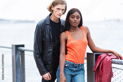 Attractive young, mixed race couple together outside in New York