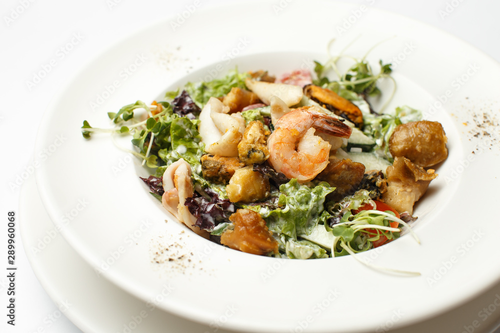 seafood with vegetables in a white plate seafood with vegetables in a white plate