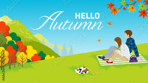 Couple enjoying Autumn nature - included words "Hello Autumn"