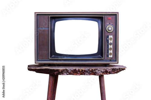 old retro color wooden home TV receiver on old wood table isolated on white background