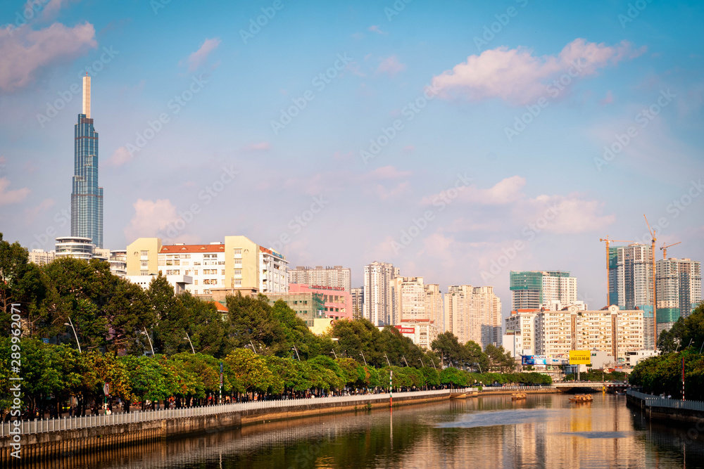 Ho Chi Minh city landscape, river with high rise building on the background during the day.