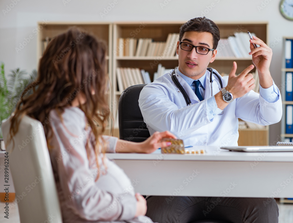 Fototapeta premium Pregnant woman visiting doctor for consultation