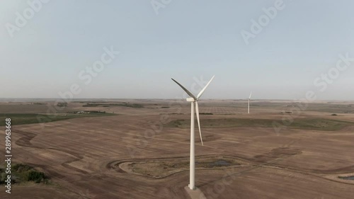 Wind Turbine slow circle around with muliple turbines in final frames photo