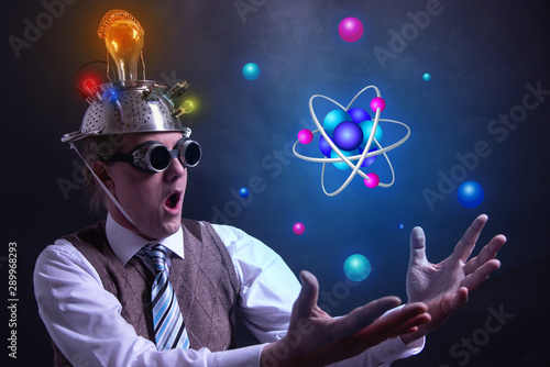 Nerd with tin foil hat presenting Atom icon