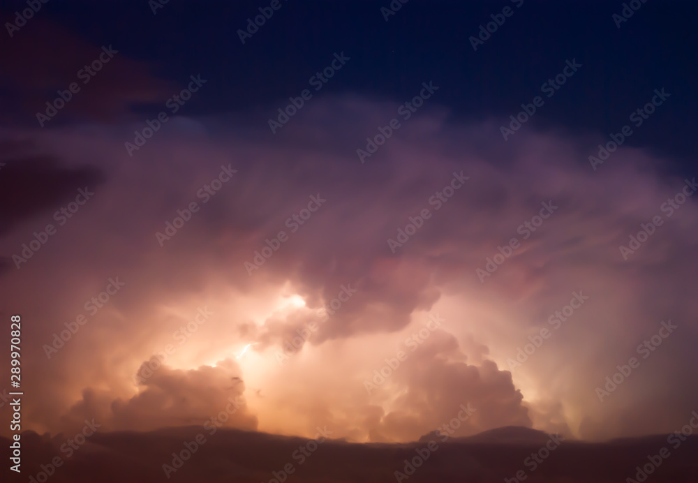 Thunderstorm Lightning at cloudy dark rainy sky.