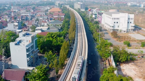 JAKARTA, Indonesia - September 10, 2019: Beautiful aerial landscape of Jakarta MRT moving on the elevated track on the morning. Shot in 4k resolution from a drone flying forwards