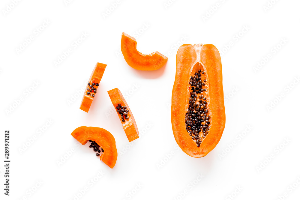 Sliced papaya on white background top view copy space Sliced papaya on white background top view copy space