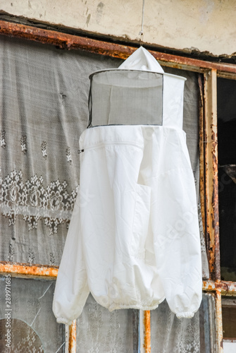 White protective outfit. Beekeeping utility for beekeepers protection.