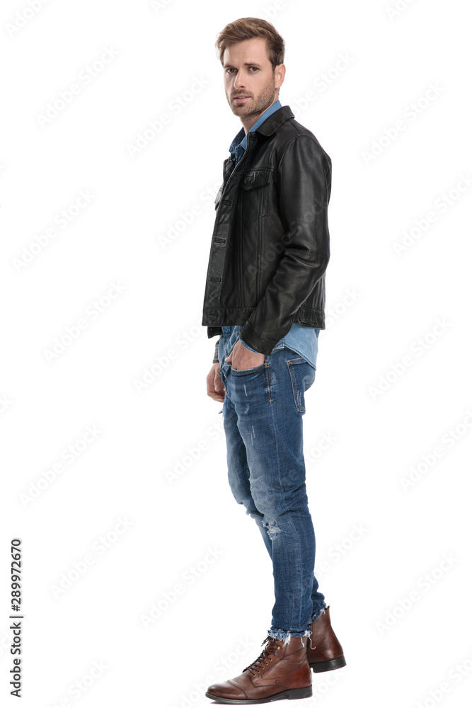 man standing with hand in pocket man standing with hand in pocket