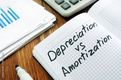 Photos Depreciation and amortization sign in a notebook.
