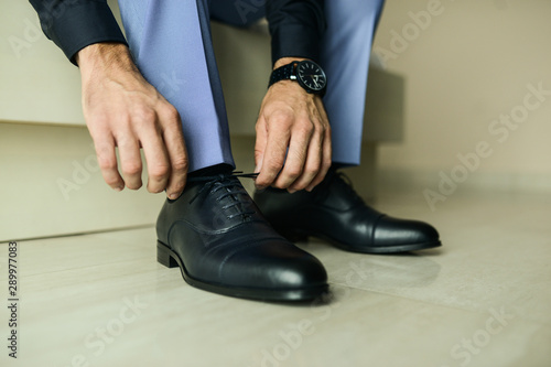 A businessman is preparing to meet with clients