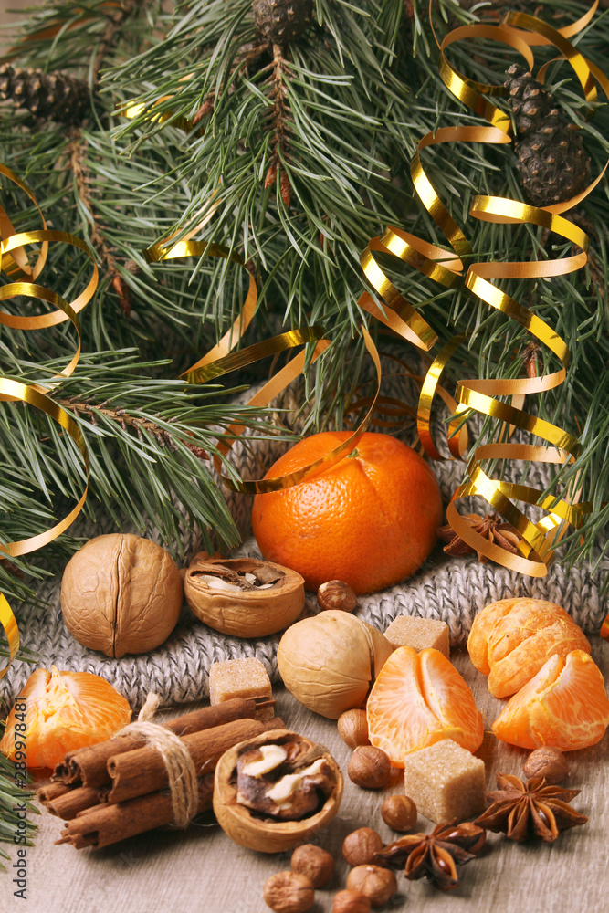 Still life formed with pine branches and New Year sweets Still life formed with pine branches and New Year sweets