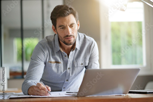 Wallpaper Mural Modern man working in office Torontodigital.ca