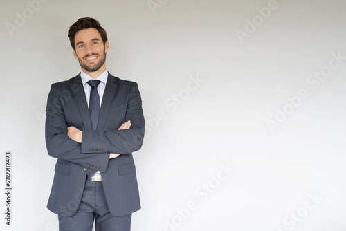 Businessman standing on white background photo