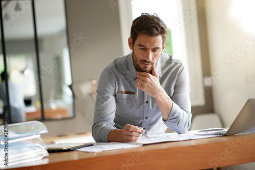 Modern man working in office