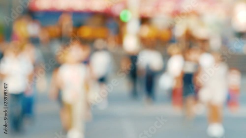 Wallpaper Mural Pedestrians in defocus cross the road at a traffic light during sunset 4k Torontodigital.ca
