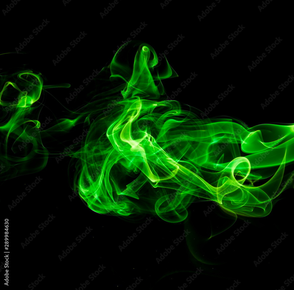 Green smoke on black background Green smoke on black background