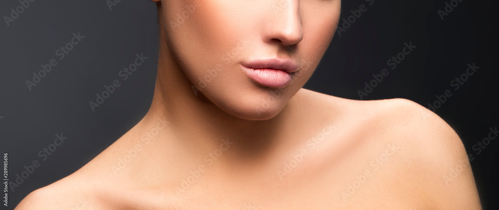 Lips, shouldrs, beauty part of face of young woman, perfect skin. Gray background Lips, shouldrs, beauty part of face of young woman, perfect skin. Gray background