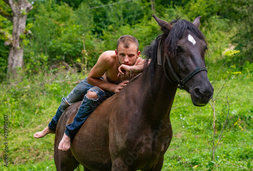 male rider relaxed on horseback © kavardakova