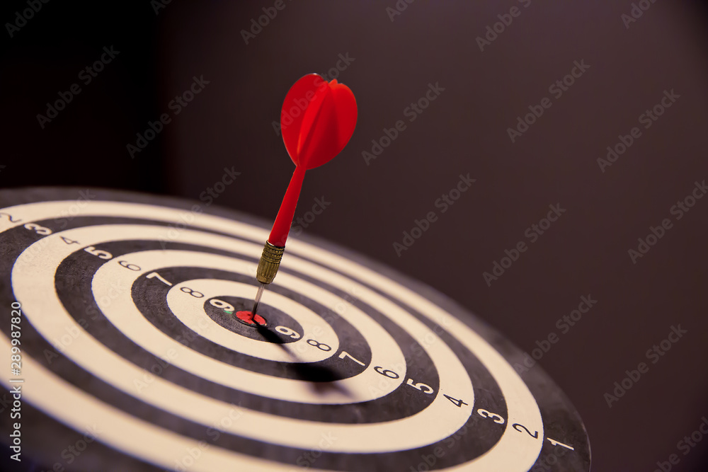 Arrow hitting in the target center of bullseye. Arrow hitting in the target center of bullseye.