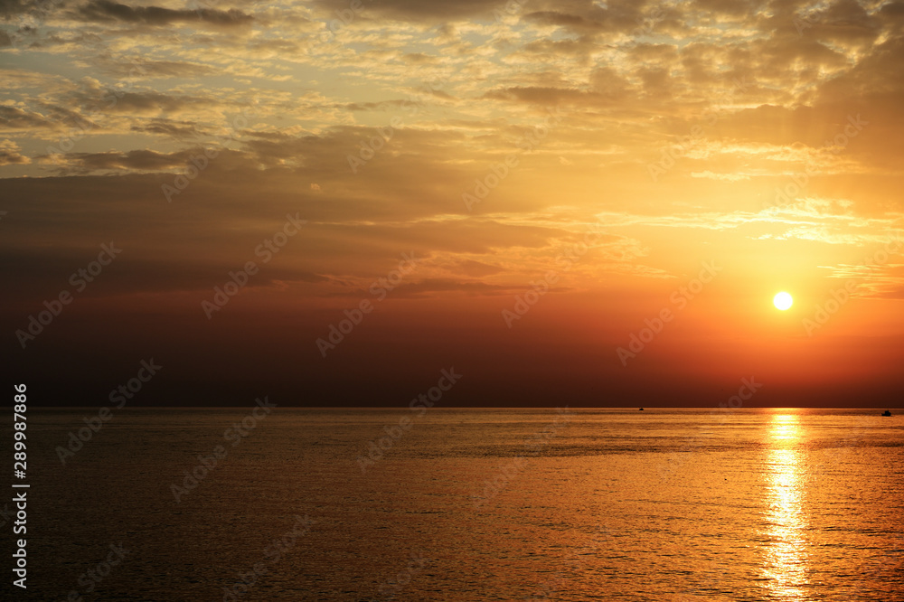 Beautiful sunrise over the sea on the coast of Sicily. Cefalu, Italy